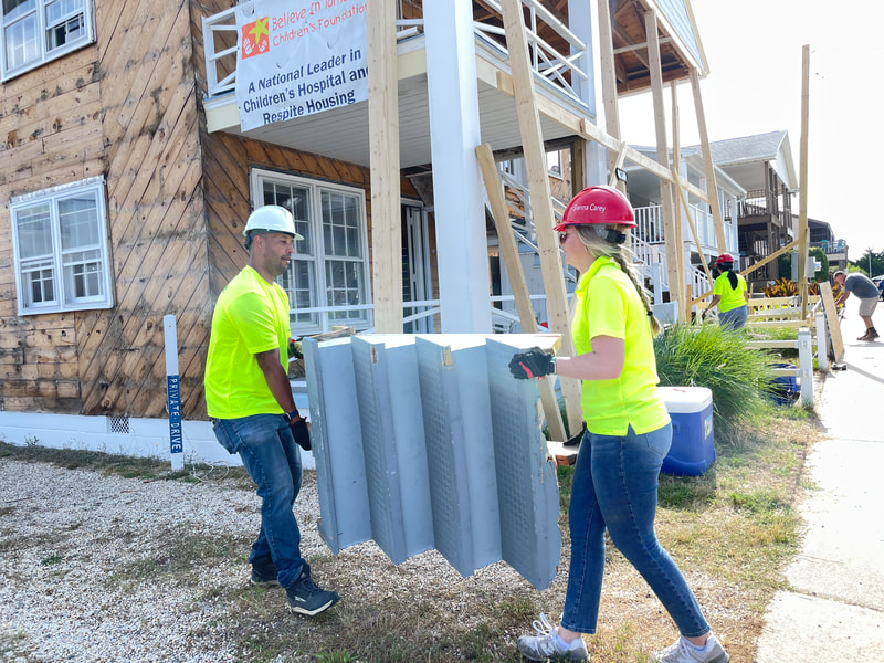 Volunteers at work on an HBCF construction project